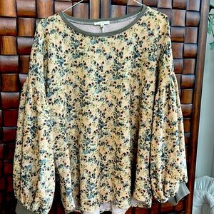 Super soft flowered sweater with fun sleeves.